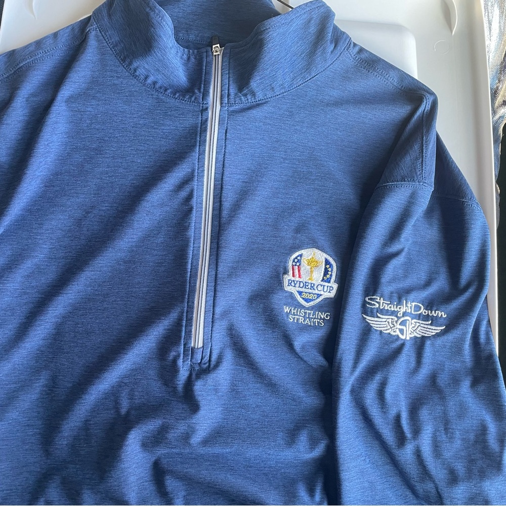 Three quarter zip long sleeve golf shirt w/ 2020 Ryder Cup logo.